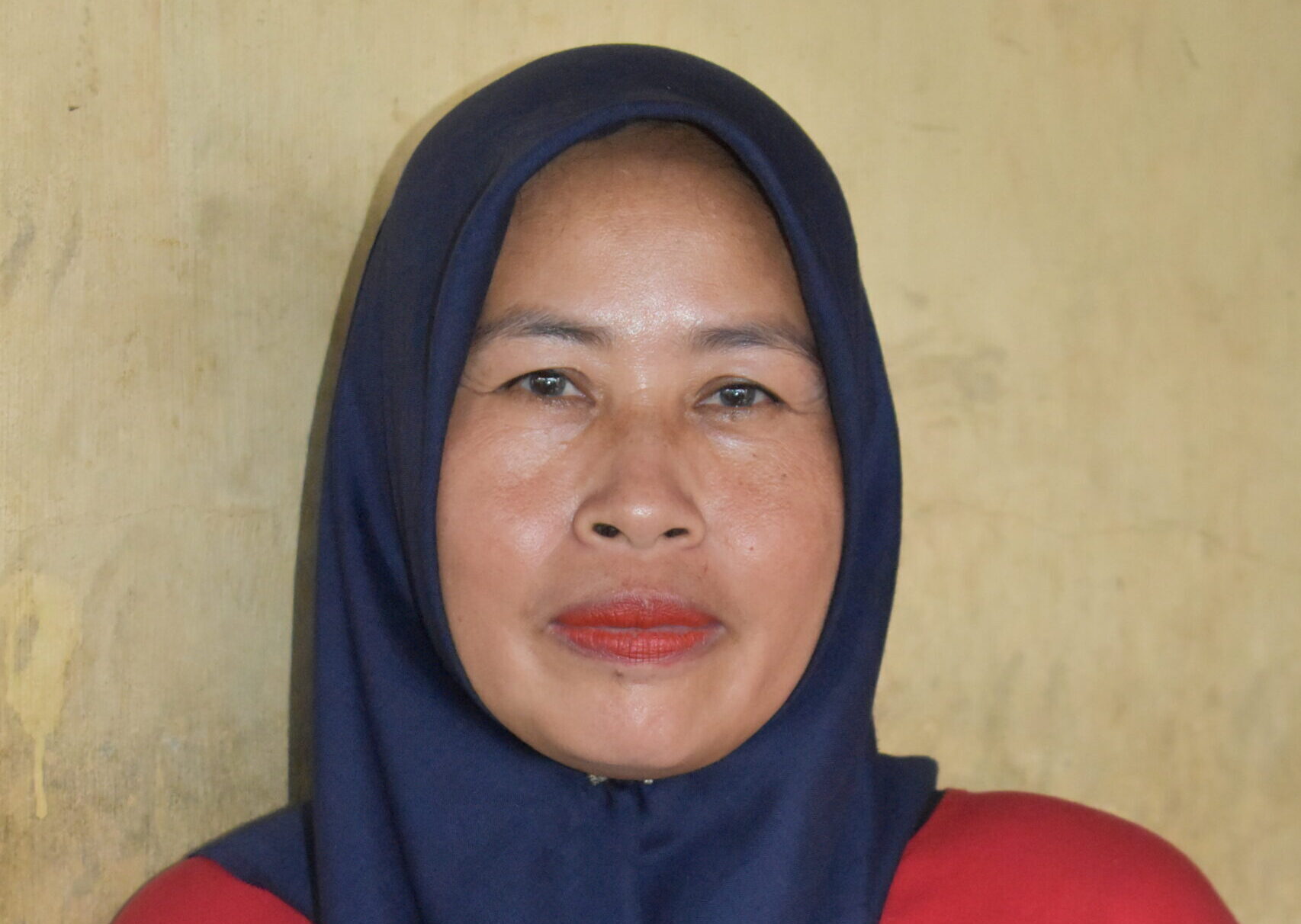 Woman in a Power of Mama red T Shirt