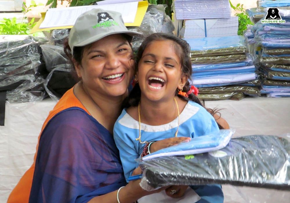 Woman and child laughing into camera